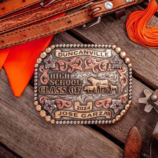 A custom belt buckle for Duncanville High School Class of 2024 personalized for Jose Garza featuring livestock animal figures